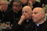 Chicago Cardinal Francis E. George, center, listens to a speaker June 12 during the annual spring meeting of the U .S. Conference of Catholic Bishops in New Orleans. (CNS photo/Bob Roller)